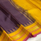 Close-up of fine gold zari checks forming a miniature grid across Deep Purple silk