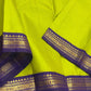 Lime-green Kanchi Kattam silk saree with minute checks and a deep purple gold zari border