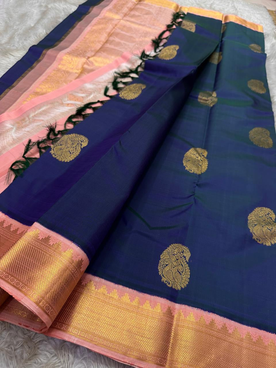 Navy checked Kanchipuram silk saree with gold zari buttas, blush pink zari border, and tassels available in the USA
