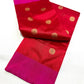 Small gold-toned flowers woven across the ruby red body of a Pattu Silk Chanderi saree.