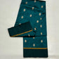Close detail of floral buttas on a peacock teal Pattu Silk Chanderi saree.