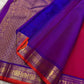 Close view of royal blue pallu with gold zari woven pattern and matching blue border with gold zari detailing.