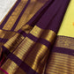 Lime chartreuse Kanjipuram silk saree body close-up showing Kudhirai flying horse antique gold zari butta motifs on plain silk ground
