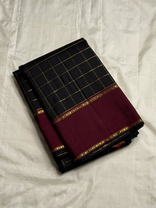 Folded Pure Kanchipuram Silk Saree in black checked weave with wide maroon zari border on ivory backdrop