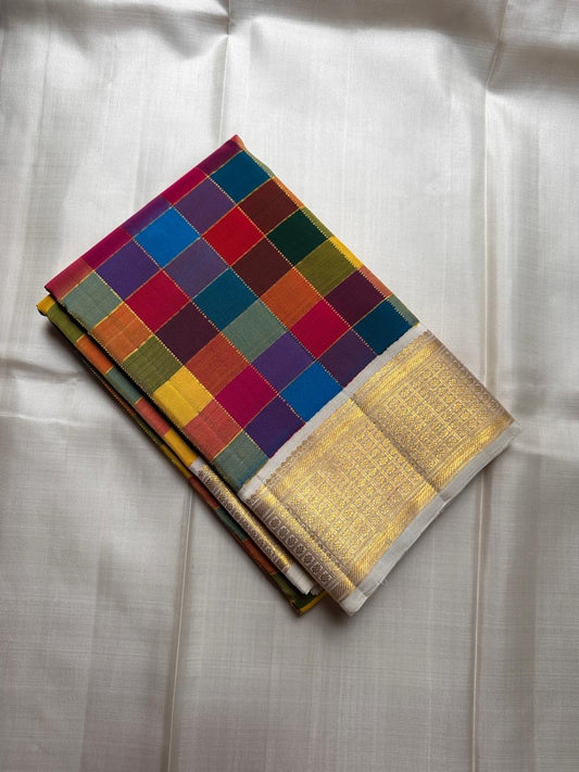 Pure Kanchipuram silk saree folded, featuring a multicolour Paalum Pazhamum checked body with antique gold zari border on an ivory base