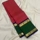 Long folded view of red checked pure Kanchipuram silk saree with green border section, navy edge, and gold zari detailing.