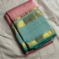 pink kanchipuram silk saree folded with sea green zari woven border