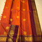 Pallu closeup of Pure Kanchipuram silk saree in deep purple with dense gold zari woven pattern and contrast border