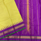 closeup of purple zari woven border with triangular edge detailing and green selvedge on kanchipuram silk saree