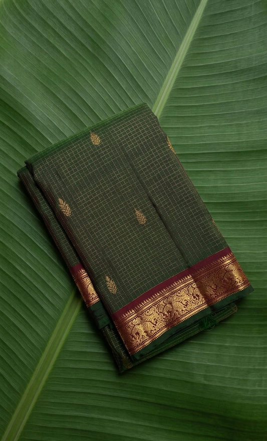 Forest emerald Kanchipuram silk saree with antique gold zari kattam and wine maroon border