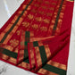 Forest green border with gold zari detail on a crimson red Katan Silk Chanderi saree