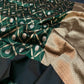 Close-up of forest green Chanderi with gold vines and silver motifs