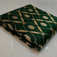 Silver-toned oval motifs woven into forest green Chanderi silk