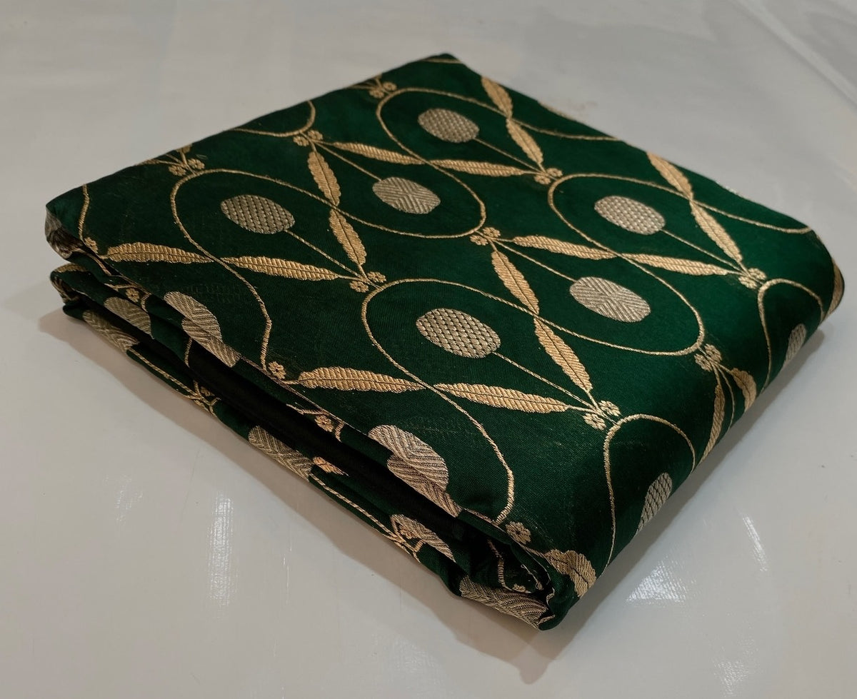 Silver-toned oval motifs woven into forest green Chanderi silk