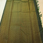 Close view of fine continuous Vairaoosi zari lines on Deep Forest Green silk.