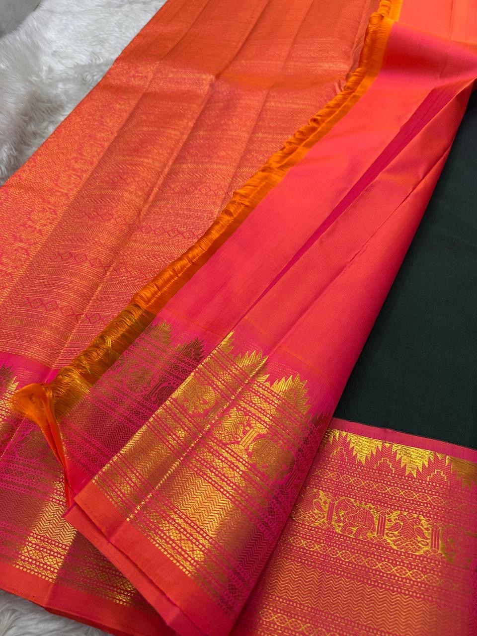 Deep Forest Green Handwoven Pure Silk Kanjeevaram Saree with Gandaberunda Zari Buttas and Rani Pink Border