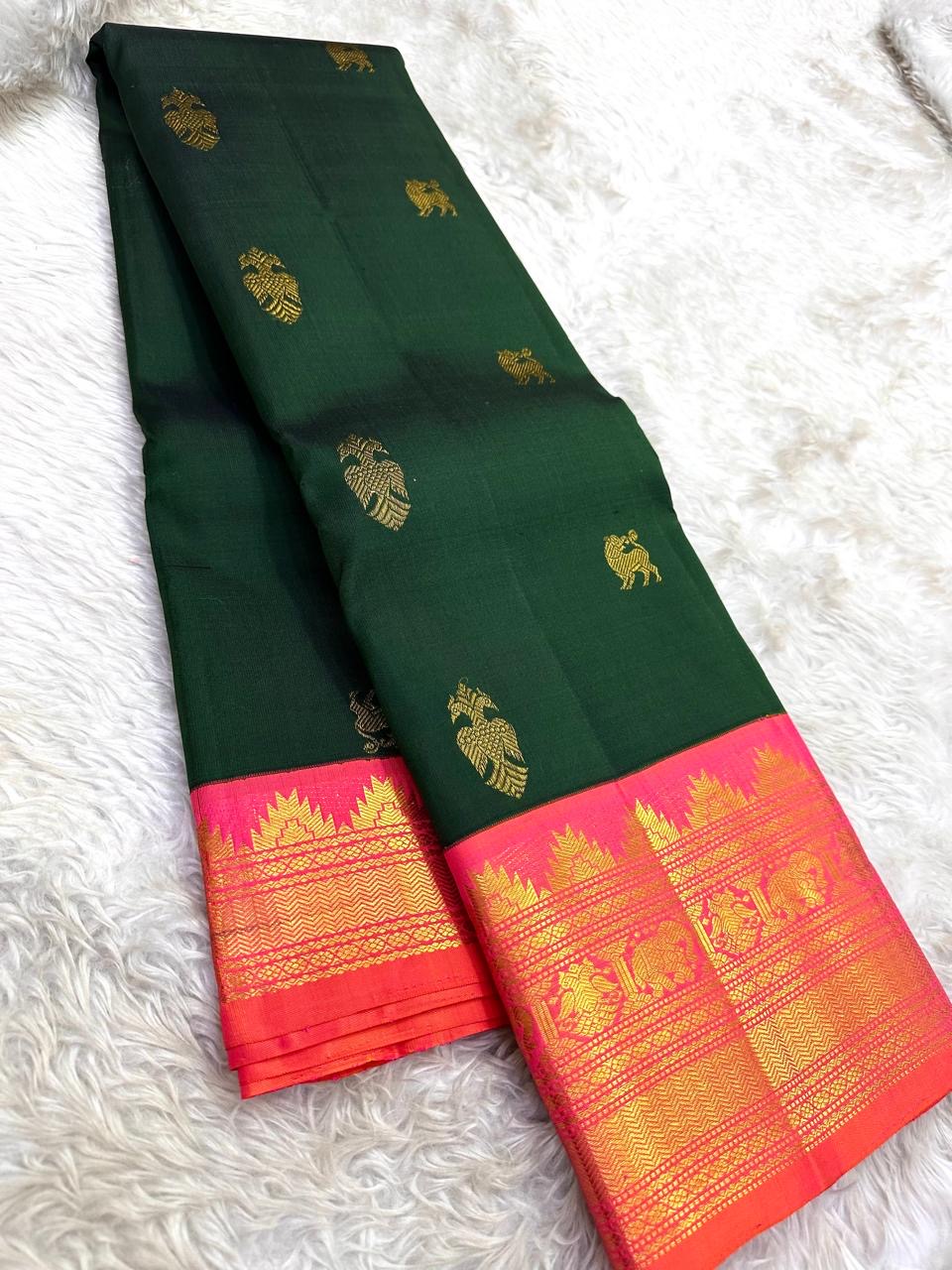 Deep Forest Green Handwoven Pure Silk Kanjeevaram Saree with Gandaberunda Zari Buttas and Rani Pink Border