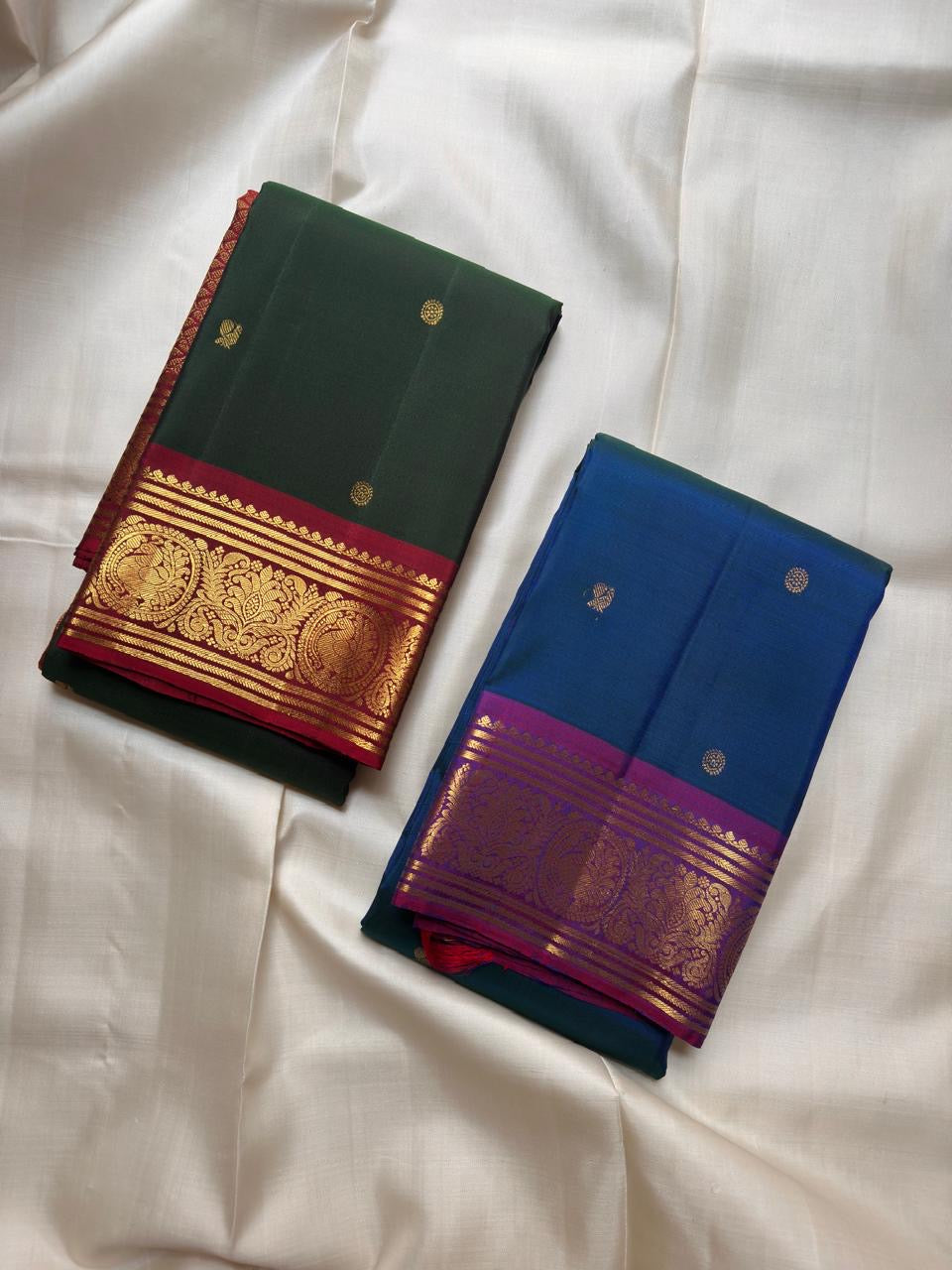 Medallion-style classic-gold zari detailing across the vivid Vadamalli Kanchipuram border.
