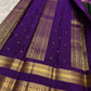 Deep forest green Kanchipuram silk saree with royal violet rettapet border and traditional zari Idam Living