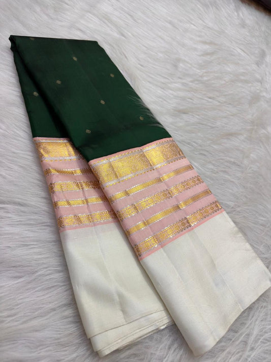Forest Green Kanchi Pattu saree with Maanga zari medallions, herringbone lines and geometric border bands