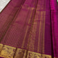 Close-up of gold zari kattam checks on forest green Kanchipuram silk saree