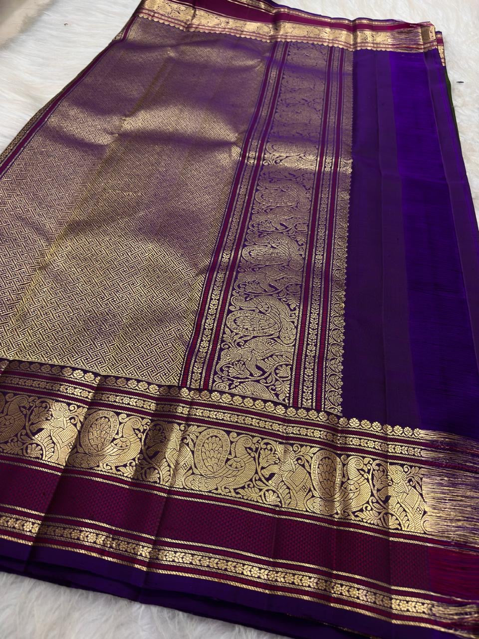 Royal Purple Kanjivaram border with elaborate antique gold zari Mayil designs