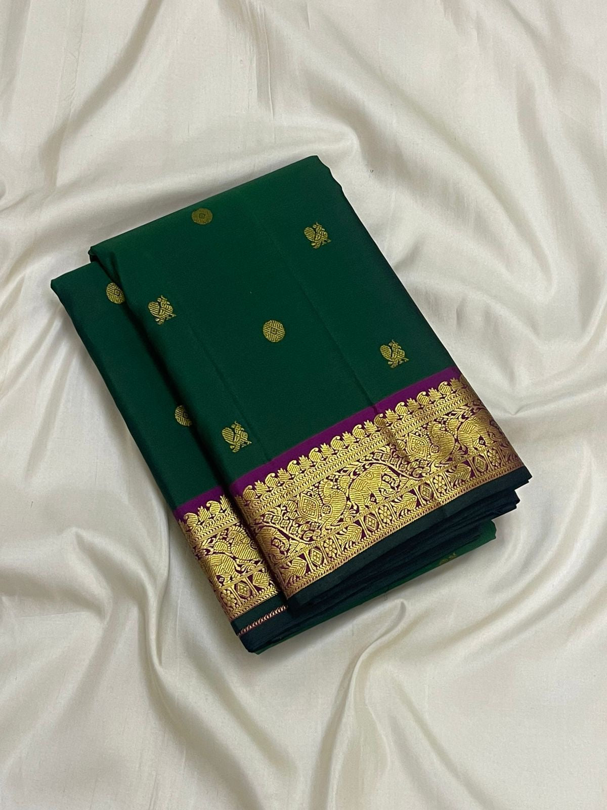 Butta close-up in gold zari on forest green Kancheepuram pure silk saree — Idam Living