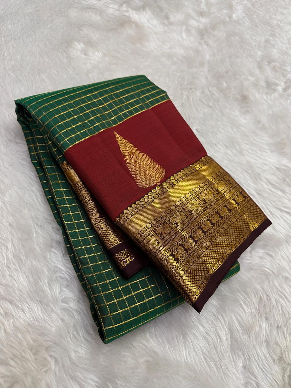 Forest green Kanchipuram silk saree with Zari Kattam weave and arakku red Thazhampoo Reku border — Idam Living