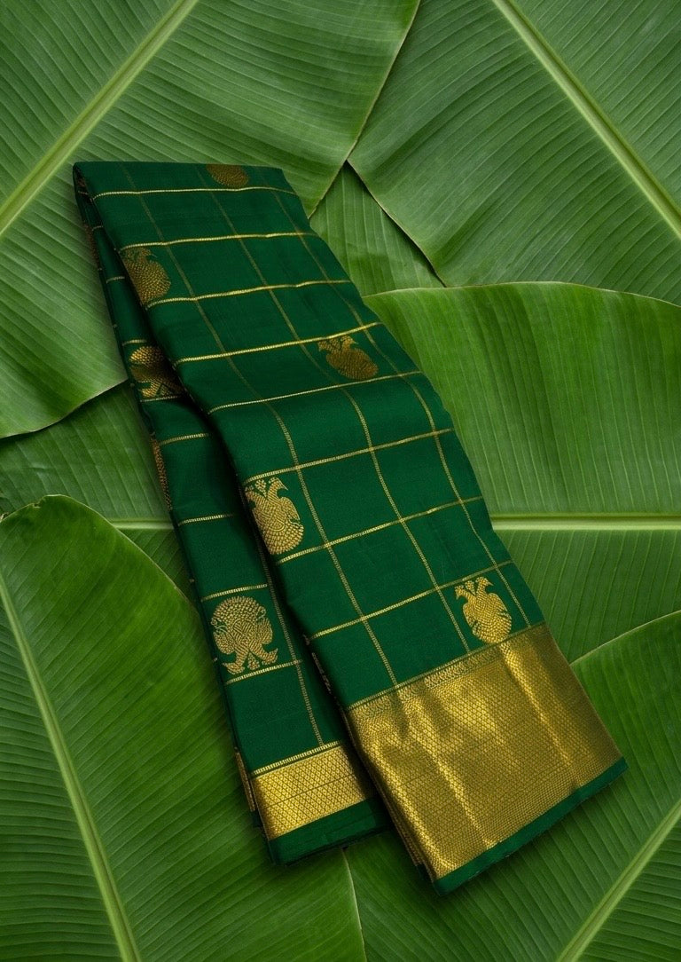 Forest green handwoven Kanchipuram pure silk saree with zari kattam and gandaberunda butta on banana leaf — Idam Living