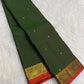 Forest green silk body showing individually spaced small classic-gold zari buttas.