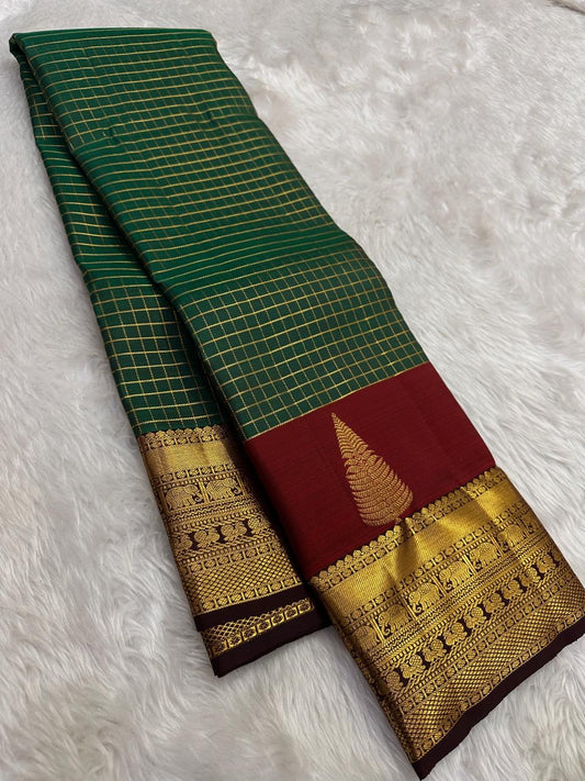 Forest green Kanjeevaram saree with Zari Kattam weave and maroon Thazhampoo Reku border — Idam Living