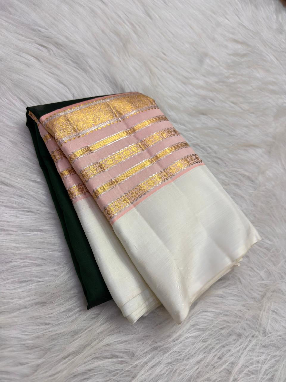 Handwoven Forest Green Kanjivaram silk saree with petite zari buttas and soft Petal Pink Varisaipet