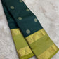 Fresh lime-green contrast border showing circular floral Chakram motifs framed by fine gold zari registers.