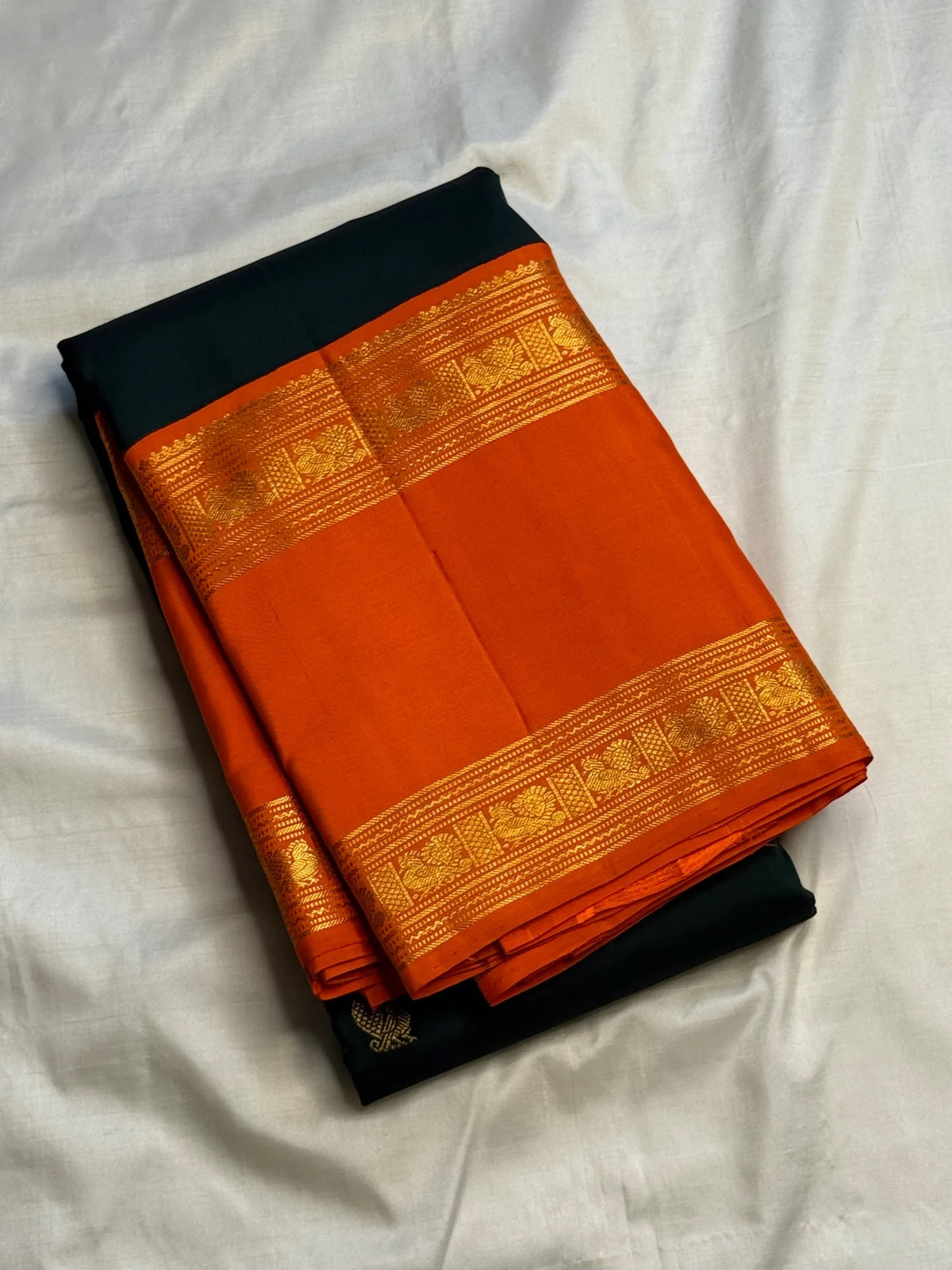 Handwoven Forest Green Kanjivaram saree with Radiant Orange contrast