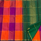 Forest green pallu of the orange and pink Kanchi Kattam silk saree