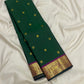 Full view of forest green Kancheepuram pure silk saree with mayil chakram butta and korvai border — Idam Living