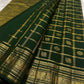 Close view of fine gold Zari Kattam checks on Deep Forest Green Kanchipuram silk