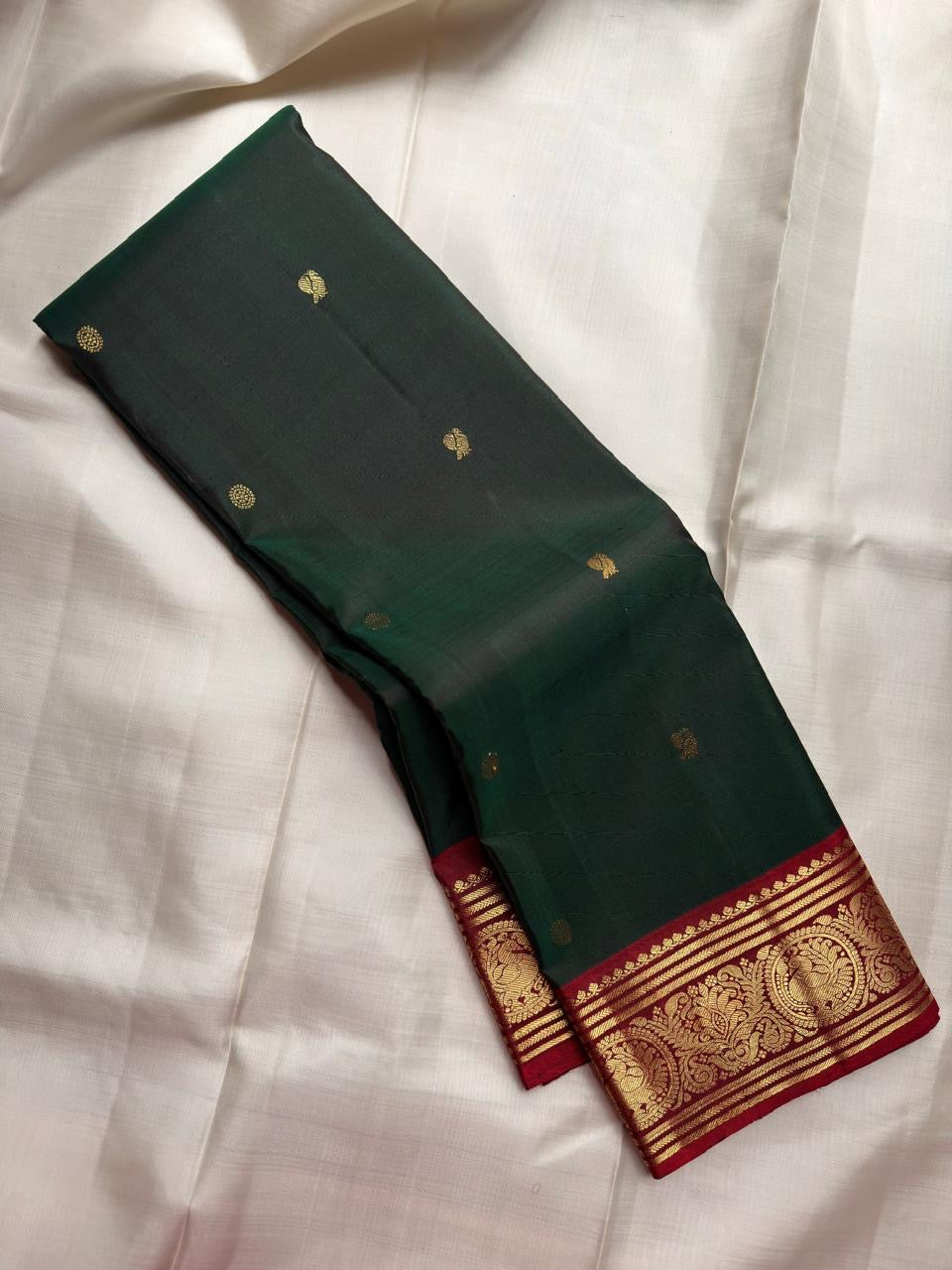 Fresh Forest Green handwoven Pure Silk Kanchipuram with restrained scattered gold zari buttas.