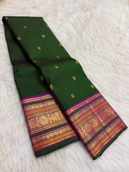 Handwoven deep leaf-and-forest pachai green Varisaipet pure silk Kanchipuram saree with rich zari border