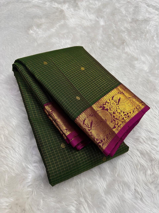 Forest green Kanchipuram saree draped, showing zari kattam checks