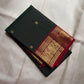 Fresh Forest Green Pure Silk Kanchipuram Butta saree with gold buttas and Deep Arakku Red zari border.
