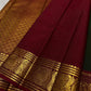 Deep Arakku Red Kanchipuram border with broad traditional classic-gold zari ornamental bands.