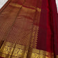 Close Arakku border detail with intricate classic-gold floral scrollwork on Kanchipuram silk.