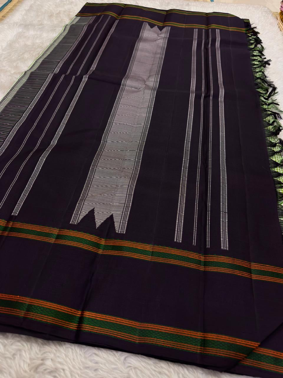 Fresh green Kancheepuram silk saree with neat podi kattam texture