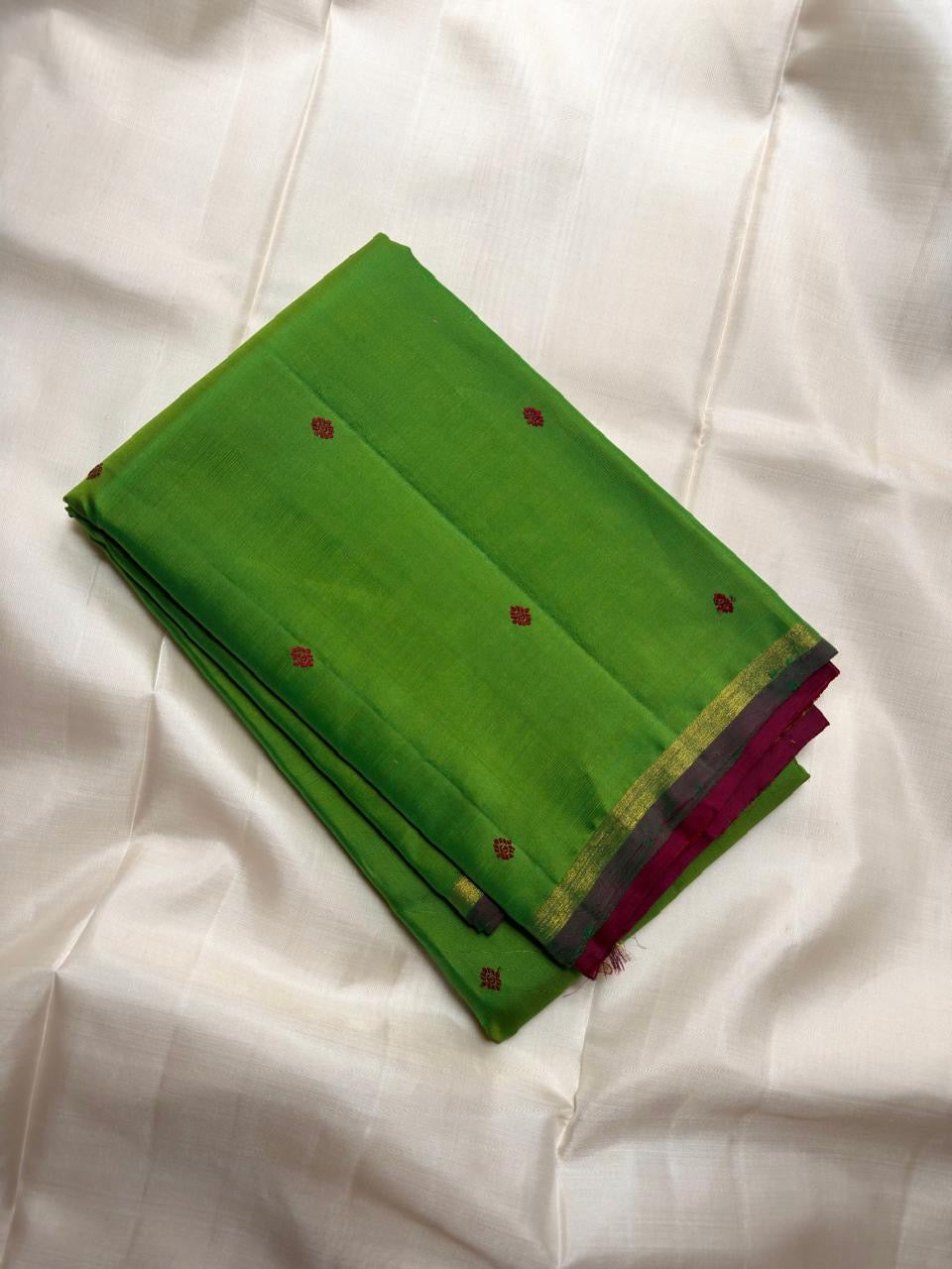 Fresh Green Kancheepuram Saree — body close-up showing petite contrast buttas