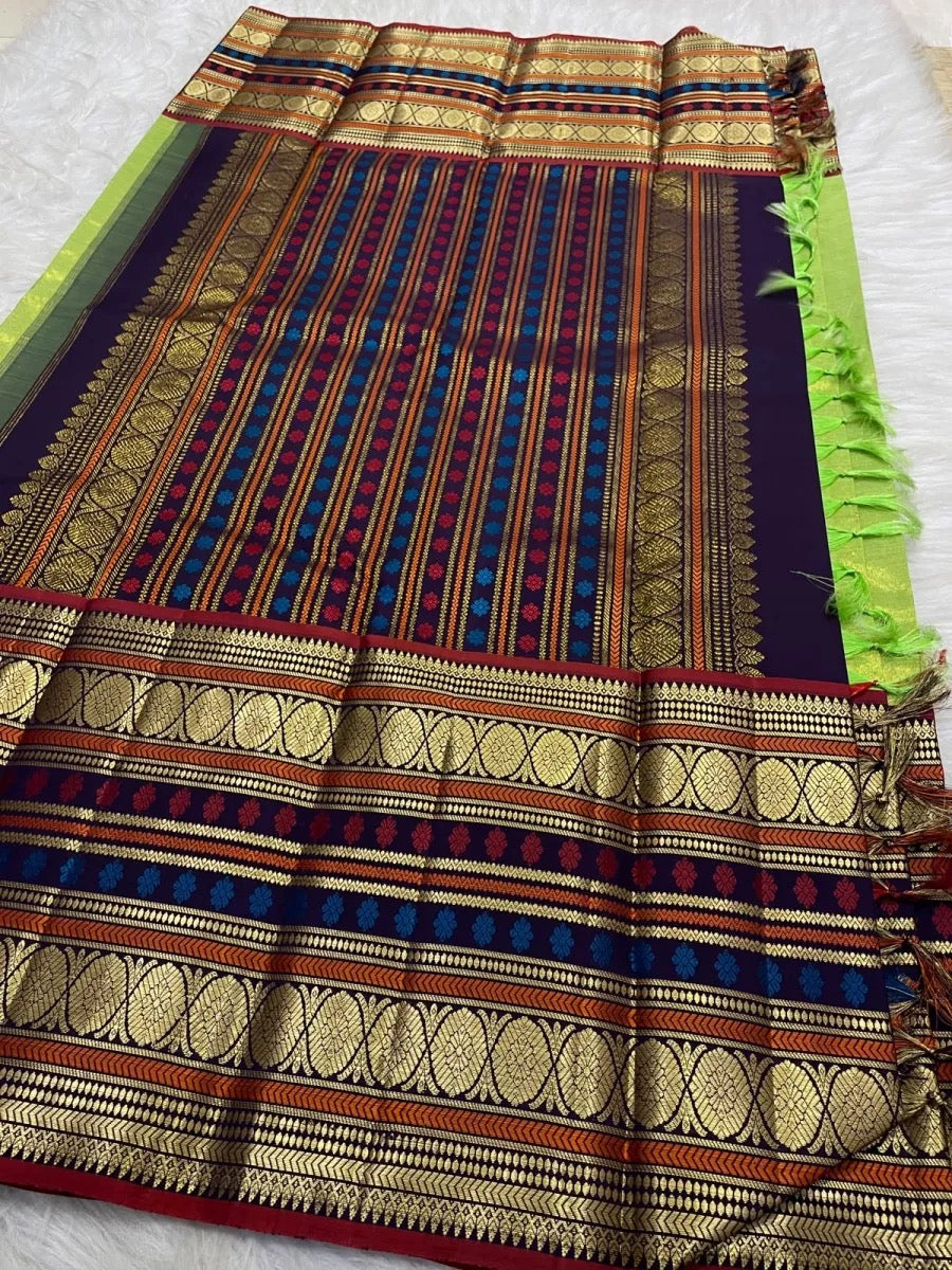 Deep violet varisaipet border with layered zari bands.