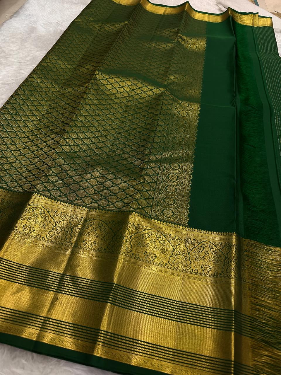 Oosi Vaanam stripes with alternating gold and silver zari buttas on Fresh Leaf Green silk.