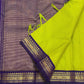 Fine green checked Kanchi Kattam silk body framed by a deep purple traditional zari border