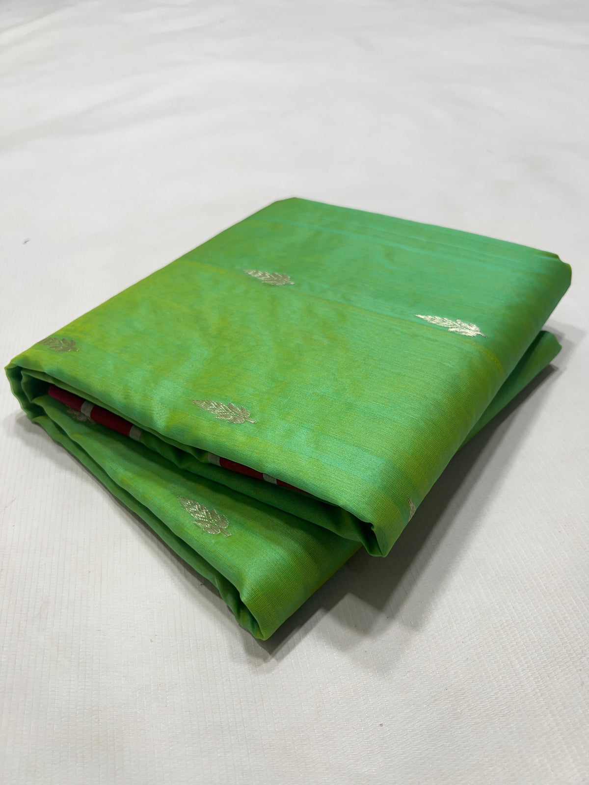 Fresh green Pure Silk Chanderi saree with deep-red border