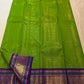 Full view of the Thulir Pachai fresh green Kanjivaram saree with royal violet border